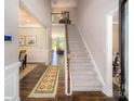 Bright and spacious entryway with hardwood floors and staircase at 139 Saidin Ln, Troutman, NC 28166