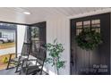 Inviting front porch with rocking chairs and a lush wreath at 202 Ross St, China Grove, NC 28023