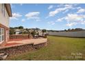 Brick patio and fenced backyard with open space at 1994 Quill Ct, Kannapolis, NC 28083
