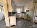 Galley-style kitchen with updated countertops and cabinets at 704 Mcadenville Rd, Lowell, NC 28098