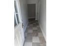 Checkerboard tiled entryway with access to other rooms at 1112 2Nd St, Lancaster, SC 29720