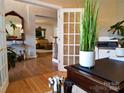 Home office with view into living room, hardwood floors and French doors at 9107 Shrewsbury Dr, Waxhaw, NC 28173