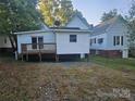 White house with deck and neighboring house at 508 S Yadkin Ave, Spencer, NC 28159