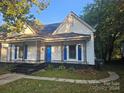 Charming white house with blue doors at 508 S Yadkin Ave, Spencer, NC 28159