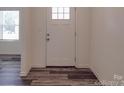 Bright entryway with hardwood floor and white door at 111 Fosters Glen Pl, Mooresville, NC 28115