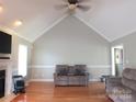 Spacious living room with hardwood floors, a fireplace, and vaulted ceilings at 2318 Joseph Ct, Rock Hill, SC 29732