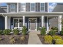 Gray house with white columns, front porch and landscaping at 235 Boxelder Rd, Clover, SC 29710