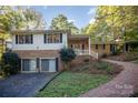 Two-story house with attached garage and brick exterior at 681 Pine Bluff Cir, Kannapolis, NC 28081