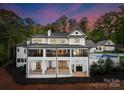 Luxury home aerial view showcasing backyard and pool at 13702 Sage Thrasher Ln, Charlotte, NC 28278