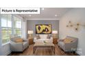Modern living room with hardwood floors and neutral decor at 5090 Silver Creek Ln, Denver, NC 28037