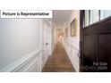 Bright entry hall with hardwood floors and elegant trim at 5090 Silver Creek Ln, Denver, NC 28037