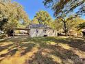 View of the back of the house and yard at 146 Linwood Dr, Albemarle, NC 28001