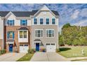 Modern 3 story townhome with 2-car garage and landscaping at 2514 Grantham Place Dr, Fort Mill, SC 29715