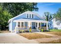 Blue house with white trim, front porch, and landscaping at 1318 W Wilson Lee Blvd, Statesville, NC 28677