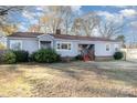 Charming gray ranch home with mature trees and a spacious front yard at 501 Hazel Ave, Kannapolis, NC 28083
