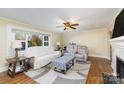 Bright living room features hardwood floors, fireplace and large windows at 501 Hazel Ave, Kannapolis, NC 28083