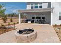 Covered patio with fire pit, seating area, and dining furniture at 2055 Sabra St # Cwo0044, Gastonia, NC 28054