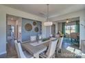 Bright dining area with large table and access to kitchen at 132 Balboa St, Matthews, NC 28104