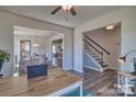 Open living area with hardwood floors and access to dining area at 132 Balboa St, Matthews, NC 28104