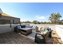 Rooftop patio with firepit and comfortable seating area at 231 Uptown West Dr, Charlotte, NC 28208