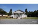 Gray house with white porch and gravel driveway at 1315 Legion Rd, Fort Mill, SC 29715