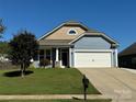 One-story home with gray and beige siding and attached garage at 3157 Delaware Dr, Denver, NC 28037