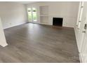 Living room with fireplace and hardwood floors at 1831 J Julian Ln # A, Charlotte, NC 28208