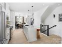 Island kitchen with white cabinets and quartz countertops at 409 Blairhill Rd # 14, Charlotte, NC 28217