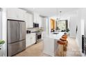 Modern kitchen with stainless steel appliances and island at 3606 S Tryon St # 16, Charlotte, NC 28217