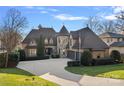 Stunning two-story home with a turret, landscaped yard, and a three-car garage at 18528 Nantz Rd, Cornelius, NC 28031