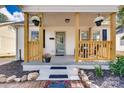 Inviting front porch with wooden posts and hanging flower baskets at 736 Cedar St, Rock Hill, SC 29730