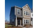 Two-story townhome, gray and tan siding, welcoming front porch at 1103 Bartholdi Dr # 0901, Gastonia, NC 28054