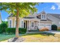 Craftsman style home with gray siding, a metal roof, and rocking chairs on the porch at 5021 Henshaw Rd, Waxhaw, NC 28173