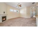 Bright living room with a fireplace and high ceilings at 151 Glade Valley Ave, Mooresville, NC 28117