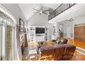 Living Room with hardwood floors, fireplace and built-in shelving at 450 Serendipity Dr, Fort Mill, SC 29715