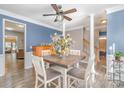 Charming dining room with blue walls and wood floors at 6859 Lakecrest Ct, Denver, NC 28037