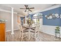 Bright dining room with wood floors and blue walls at 6859 Lakecrest Ct, Denver, NC 28037