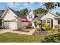 Two-story house with attached garage and patio at 6859 Lakecrest Ct, Denver, NC 28037