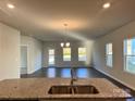 Spacious kitchen with granite countertops and stainless steel appliances at 1040 Bull Dog Ln, Wingate, NC 28174