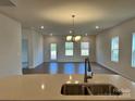 Kitchen features a large island with double sink and an open floor plan at 1044 Bull Dog Ln, Wingate, NC 28174