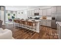 Open kitchen with stainless steel appliances and breakfast bar at 1053 Bull Dog Ln, Wingate, NC 28174