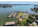 Aerial view of lakefront property with marina and boat slips at 309 Commodore Loop, Mooresville, NC 28117