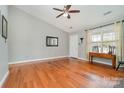 Bright living room with hardwood floors, fireplace, and vaulted ceiling at 2505 Bass Ct, Harrisburg, NC 28075