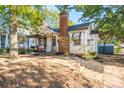 Front view of a bungalow with landscaping and walkway at 710 Wood St, Statesville, NC 28677