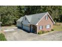 Brick home with attached two-car garage and a large driveway at 3540 Highway 324 Hwy, Rock Hill, SC 29732