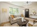 Living room with a comfy sofa, coffee table, and large window at 9519 Feldbank Dr, Charlotte, NC 28216