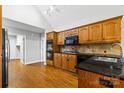 Kitchen with wood cabinets, granite countertops, and stainless steel appliances at 4823 Morris Glen Dr, Concord, NC 28027