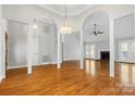 Spacious dining room with hardwood floors and a view into the Gathering room at 4823 Morris Glen Dr, Concord, NC 28027