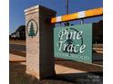 Pine Trace neighborhood entrance sign with brick pillars and green signage at 4057 Port Richmond Ave # 13, Gastonia, NC 28056