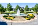 Bailey's Glen community entrance with circular fountain at 12724 Hazelbrook Ln, Cornelius, NC 28031